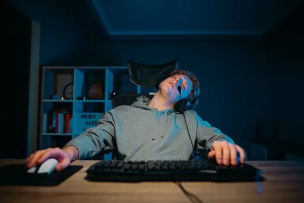 Gamer sleeping while gaming on All About Esports